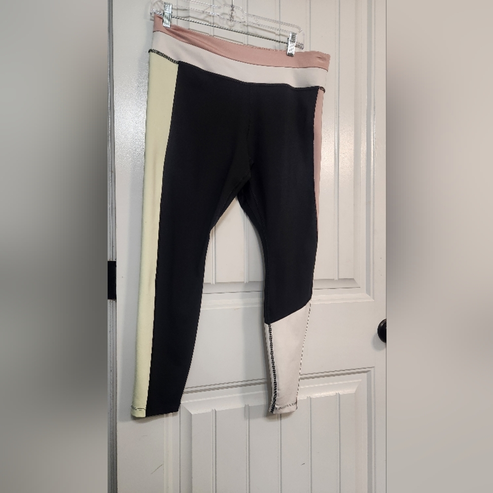 Nike Women Leggings in Black, Cream, and Pink And Neon Yellow. Above Ankles.